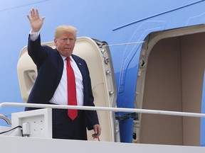 U.S. President Donald Trump waves as he boards Air Force One at Andrews Air Force Base, Md., Thursday, May 31, 2018, for a trip to Houston, Texas, to meet the Santa Fe family members and community leaders. (AP Photo/Manuel Balce Ceneta)