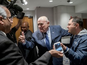 Rudy Giuliani, centre, an attorney for U.S. President Donald Trump, leaves after speaking at the Iran Freedom Convention for Human Rights and Democracy in Washington, D.C. on Saturday, May 5, 2018.