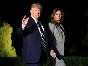 President Donald Trump, with first lady Melania Trump, leaves the White House in Washington, early Thursday, May 10, 2018, to greet three freed Americans detained in North Korea for over a year, who are arriving at Joint Base Andrews, Md.