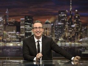 This image released by HBO shows John Oliver, host of "Last Week Tonight with John Oliver." Oliver said Sunday that he'd achieved all he'd wanted for the show by having an Australian animal hospital's special ward to treat a chlamydia outbreak among koalas named for him. He said, "goodbye, forever, everyone," as stagehands broke up his set around him. That inspired a wave of social media posts among fans wondering if he was serious.