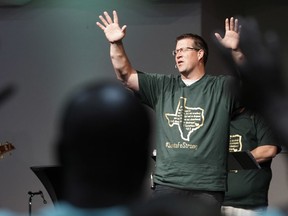 Dayspring Church senior pastor Brad Drake leads his congregation in prayer Sunday, May 20, 2018, in Santa Fe, Texas.