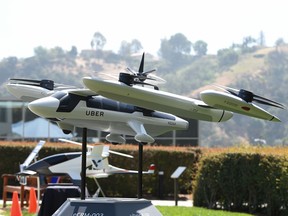 Uber introduced it's electric powered "flying taxi" vertical take-off and landing concept aircraft at the event, which showcases prototypes for UberAir's fleet of airborne taxis. (ROBYN BECK/AFP/Getty Images)