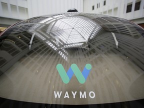 In this Dec. 13, 2016, file photo a skylight is reflected in the rear window of a Waymo driverless car during a Google event in San Francisco. (AP Photo/Eric Risberg, File)