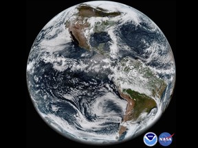 This image provided by NOAA/NASA on Thursday, May 31, 2018 shows the Earth’s western hemisphere at 12:00 p.m. EDT on May 20, 2018 made by the new GOES-17 satellite, using the Advanced Baseline Imager (ABI) instrument. The weather satellite observes Earth from about 22,300 miles above the surface. Despite a serious cooling problem, the newest U.S. weather satellite has produced sharp snapshot of Earth. On May 23, 2018, NOAA reported that critical infrared sensors in the satellite’s main instrument were not staying cold enough. (NOAA/NASA via AP)