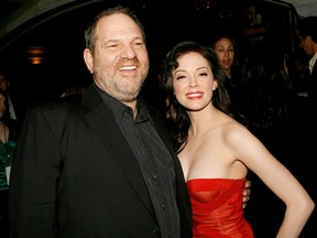 Producer Harvey Weinstein (L) and actress Rose McGowan arrive to the premiere of "Grindhouse" at the Orpheum Theatre on March 26, 2007 in Los Angeles.