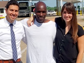 This undated photo provided by Amir Ali shows Ali, from left, Corey Williams and Ali's co-counsel Blythe Taplin posing for a photo at the Louisiana State Penitentiary in Angola, La.