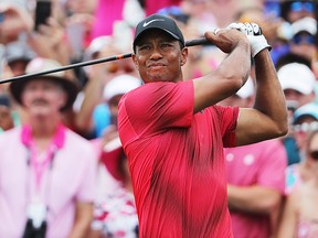 Tiger Woods of the United States plays his shot from the first tee during the final round of THE PLAYERS Championship on the Stadium Course at TPC Sawgrass on May 13, 2018 in Ponte Vedra Beach, Florida.  (Photo by Richard Heathcote/Getty Images)