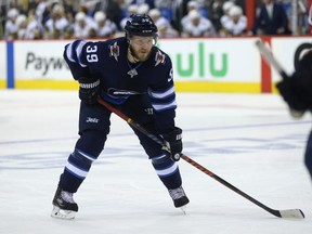 Winnipeg Jets defenceman Toby Enstrom sets up for a face-off against the Vegas Golden Knights during Game 1 of their Western Conference final series in Winnipeg on Sat., May 12, 2018. Kevin King/Winnipeg Sun/Postmedia Network