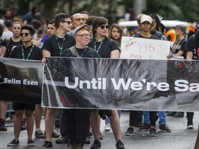 Marchers in black T-shirts paid tribute to the victims of alleged serial killer Bruce McArthur. (ERNEST DOROSZUK, Toronto Sun)