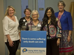 Jen Wiles, far left, and Shanaaz Gokool, CEO of Dying with Dignity Canada, second from the right, pose with other speakers ahead of an end-of-life speech on Saturday, June 2, 2018. (Zach Laing / Postmedia Network)