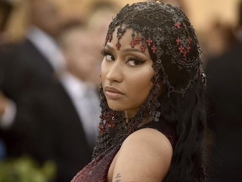 Nicki Minaj poses topless with beaded nipple pasties in risque shot for new  album Queen