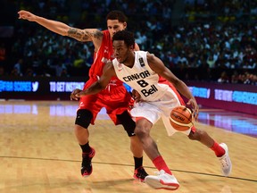 Mexico´s Juan Toscano (L) vies for the ball with Andrew Wiggins (R) of Canada, during their 2015 FIBA Americas Championship Men's Olympic qualifying match at the Sport Palace in Mexico City on September 8, 2015. (Andrew Nembhard not pictured)