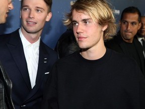 Patrick Schwarzenegger (L) and Justin Bieber attend Global Road Entertainment's world premiere of "Midnight Sun" at ArcLight Hollywood on March 15, 2018 in Hollywood, California.