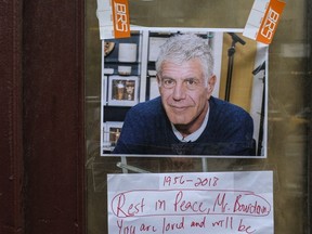 Notes, photographs and flowers are left in memory of Anthony Bourdain at the closed location of Brasserie Les Halles, where Bourdain used to work as the executive chef, June 8, 2018 in New York City.