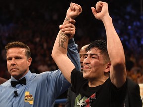 Leo Santa Cruz celebrates defeating Abner Mares (not pictured) in their WBA Featherweight Title & WBC Diamond Title fight at Staples Center on June 9, 2018 in Los Angeles, California. (Jayne Kamin-Oncea/Getty Images)