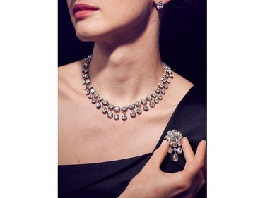 A model shows a diamond parure composed of 95 diamonds, including five solitaire diamonds that belonged to Marie-Antoinette, Queen of France and will be auctioned in the "Royal Jewels from the Bourbon-Parma Family" sale at Sotheby's Geneva on Nov. 12, 2018, at Sotheby's on June 12, 2018 in London, England.