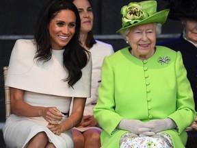 Queen Elizabeth II sits with Meghan, Duchess of Sussex during a ceremony to open the new Mersey Gateway Bridge on June 14, 2018 in the town of Widnes in Halton, Cheshire, England. Meghan Markle married Prince Harry last month to become The Duchess of Sussex and this is her first engagement with the Queen. During the visit the pair will open a road bridge in Widnes and visit The Storyhouse and Town Hall in Chester.