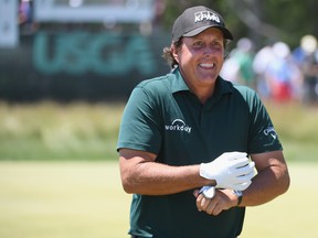 Phil Mickelson of the United States smiles on the third green during the third round of the 2018 U.S. Open at Shinnecock Hills Golf Club on June 16, 2018 in Southampton, New York. (Ross Kinnaird/Getty Images)