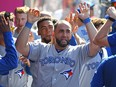 Kendrys Morales of the Toronto Blue Jays is congratulated in the dugout after hitting a go-ahead solo home run in the tenth inning game against the Los Angeles Angels of Anaheim at Angel Stadium on June 24, 2018 in Anaheim, Calif. (Jayne Kamin-Oncea/Getty Images)