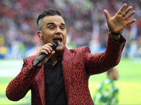 English musician Robbie Williams performs during the Russia World Cup opening ceremony before the tournament's first match between Russia and Saudi Arabia on June 14, 2018 at Moscows Luzhniki Stadium. (Patrik Stollarz/Getty Images)