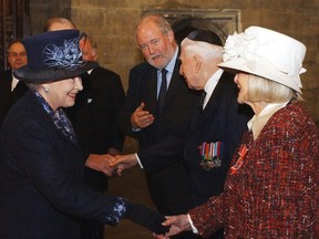 In this Thursday, Jan. 27, 2005 file photo, Britain's Queen Elizabeth II, left, meets Holocaust survivor Gena Turgel during a service to remember victims of the Holocaust in Westminster Central Hall in London on the 60th anniversary of the liberation of Auschwitz.