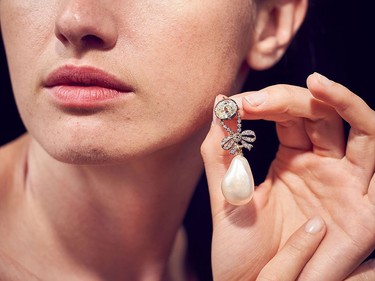 A model shows a stunning diamond pendant, supporting a natural pearl of exceptional size (26 mm x 18 mm) that belonged to Marie-Antoinette, Queen of France and will be auctioned in the "Royal Jewels from the Bourbon-Parma Family" sale at Sotheby's Geneva on Nov. 12, 2018, at Sotheby's on June 12, 2018 in London, England.