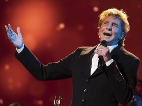 In this April 19, 2017 file photo, Barry Manilow performs at the world premiere of "Clive Davis: The Soundtrack of Our Lives" during the 2017 Tribeca Film Festival in New York.