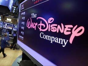 The Walt Disney Co. logo appears on a screen above the floor of the New York Stock Exchange on Aug. 8, 2017. (AP Photo/Richard Drew)