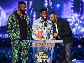 (L-R) Actors Winston Duke, Chadwick Boseman, and Michael B. Jordan accept the Best Movie award (Presented by Toyota) for 'Black Panther' onstage during the 2018 MTV Movie And TV Awards at Barker Hangar on June 16, 2018 in Santa Monica, Calif.