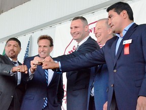 From left, International Boxing Hall of Fame Class of 2018 inductees Ronald Wright, Steve Albert, Vitali Klitschko, Jim Gray, and Erik Morales present their Hall of Fame rings to the crowd gathered in Canastota, N.Y., on Sunday, June 10, 2018.