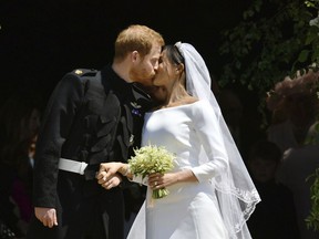 FILE - In this Saturday, May 19, 2018 file photo, Britain's Prince Harry and Meghan Markle leave after their wedding ceremony at St. George's Chapel in Windsor Castle in Windsor, near London, England. Thomas Markle, the father of the former Meghan Markle, said Monday June 18, 2018, he wishes he could have walked her down the aisle during her wedding to Prince Harry.