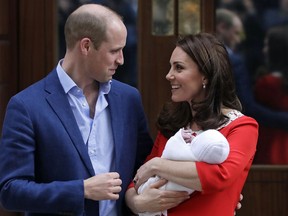 FILE - In this Monday, April 23, 2018 file photo, Britain's Prince William and Kate, Duchess of Cambridge pose for a photo with their newborn baby son as they leave the Lindo wing at St Mary's Hospital in London. Kensington Palace said Wednesday June 20, 2018, Prince Louis will be christened on July 9 by Archbishop of Canterbury Justin Welby. The third son of Prince William and his wife Kate, Duchess of Cambridge was born April 23 and is fifth in line to the throne.
