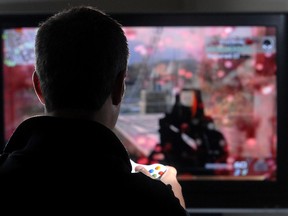 A gamer plays the popular online multiplayer game Call of Duty: Modern Warfare. (Craig Glover/The London Free Press)