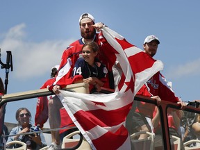 Washington Capitals goaltender Philipp Grubauer, of Germany, points to fans during the Stanley Cup NHL hockey victory parade in Washington, Tuesday, June 12, 2018.