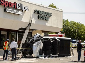 Authorities work at the scene where a pickup truck drove into a Starbucks parking lot and on to an outdoor patio, Friday June 8, 2018, at a Salt Lake City suburban shopping center in Millcreek, Utah. One person is dead and several others injured. (Trent Nelson/The Salt Lake Tribune via AP)