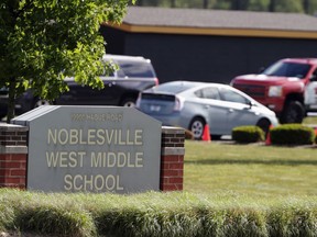 In this May 30, 2018, file photo, parents drive students to school as they return to class for the first time at Noblesville West Middle School since a shooting last week in Noblesville, Ind. (AP Photo/Michael Conroy)