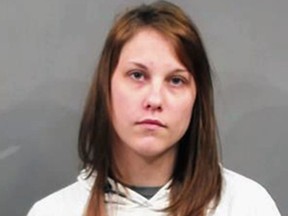 In this May 24, 2018, file booking photo, provided by the Sedgwick County Sheriff's Office in Wichita, Kan., shows Emily Glass, of Wichita, after her arrest and booking into the Sedgwick County jail after a body that is believed to be her stepson, Lucas Hernandez, was found in a nearby county. (Sedgwick County Sheriff's Office via AP)
