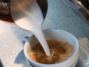 In this Sept. 22, 2017, file photo, a barista pours steamed milk into a cup of coffee at a cafe in Los Angeles.