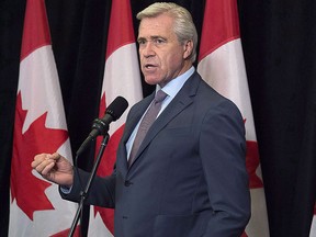 Newfoundland and Labrador Premier Dwight Ball talks with reporters as the Liberal cabinet meets in St. John's, N.L., on Sept. 12, 2017.