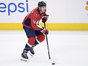 This May 17, 2018, file photo shows Washington Capitals defenseman John Carlson skating with the puck during the third period of Game 4 of the NHL Eastern Conference finals hockey playoff series against the Tampa Bay Lightning in Washington.  (AP Photo/Nick Wass, File)