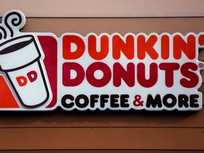 A Dunkin' Donuts logo on a shop in Mount Lebanon, Pa. on Jan. 22, 2018. (AP Photo/Gene J. Puskar)