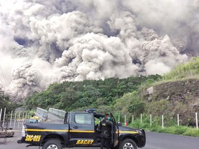 This handout picture released by the National Police of Guatemala shows policemen during search operations around Volcano Fuego after an eruption in Guatemala on June 3, 2018. (AFP PHOTO/National Police of Guatemala/HO)