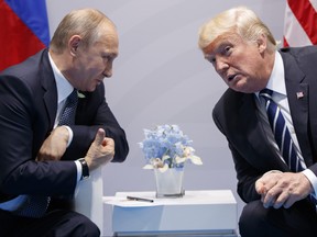 In this Friday, July 7, 2017, file photo U.S. President Donald Trump meets with Russian President Vladimir Putin at the G-20 Summit in Hamburg.  (AP Photo/Evan Vucci, FILE)