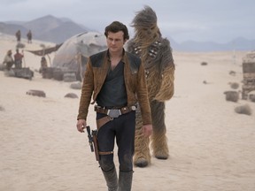 This undated file image released by Lucasfilm shows Alden Ehrenreich and Joonas Suotamo in a scene from "Solo: A Star Wars Story."