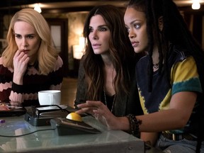 This image released by Warner Bros. shows Sarah Paulson, from left, Sandra Bullock and Rihanna in a scene from "Ocean's 8."