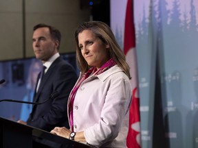 Canadian Minister of Foreign Affairs Chrystia Freeland and Minister of Finance Bill Morneau participate in a media availability during the G7 leaders summit in La Malbaie, Que., on Friday, June 8, 2018. (The Canadian Press/Justin Tang)