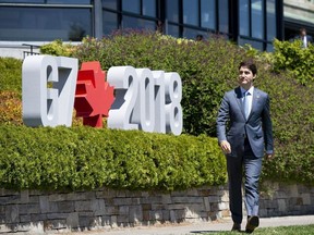 Canada's Prime Minister Justin Trudeau arrives for a welcoming ceremony for representatives from outreach countries and international organizations during the G7 leaders summit in La Malbaie, Que., on Saturday, June 9, 2018.