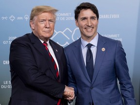 Canada's Prime Minister Justin Trudeau meets with U.S. President Donald Trump at the G7 leaders summit in La Malbaie, Que., on Friday, June 8, 2018.