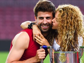 Gerard Pique of FC Barcelona and Shakira pose with the trophy after FC Barcelona won the Copa del Rey Final match against Athletic Club at Camp Nou on May 30, 2015 in Barcelona, Spain.  (David Ramos/Getty Images)