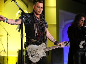 Johnny Depp and Alice Cooper from The Hollywood Vampires perform at the 2016 Starkey Hearing Foundation "So the World May Hear" awards gala at the St Paul RiverCentre on July 17, 2016 in St Paul, Minnesota. (Photo by Adam Bettcher/Getty Images for Starkey Hearing Foundation)